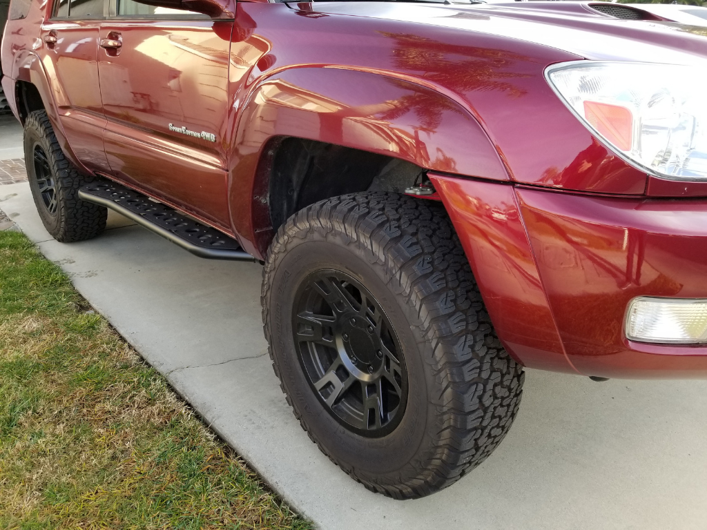 Front passenger side view of Toyota 4Runner with Step Edition bolt on rock sliders - Cali Raised LED